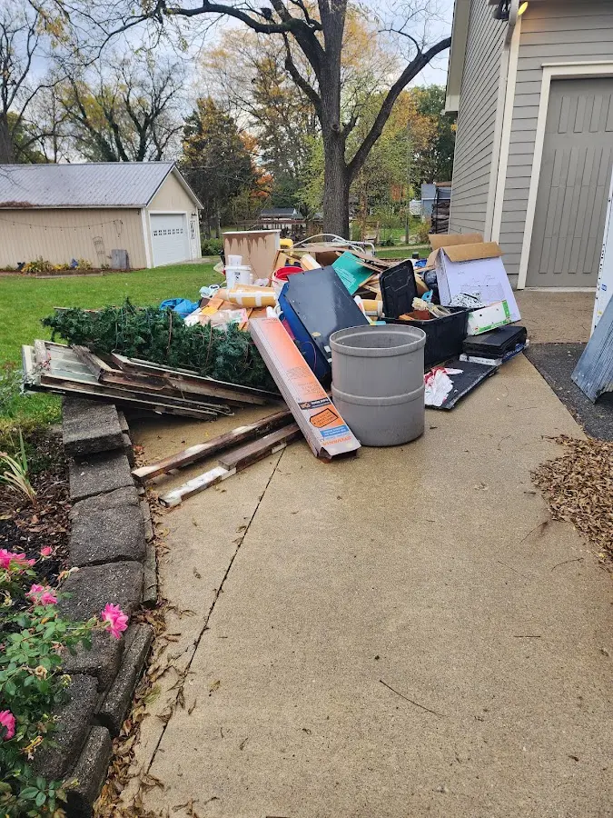 Dumpster being loaded with debris for Estate Cleanout Dumpster Rental in Centralia